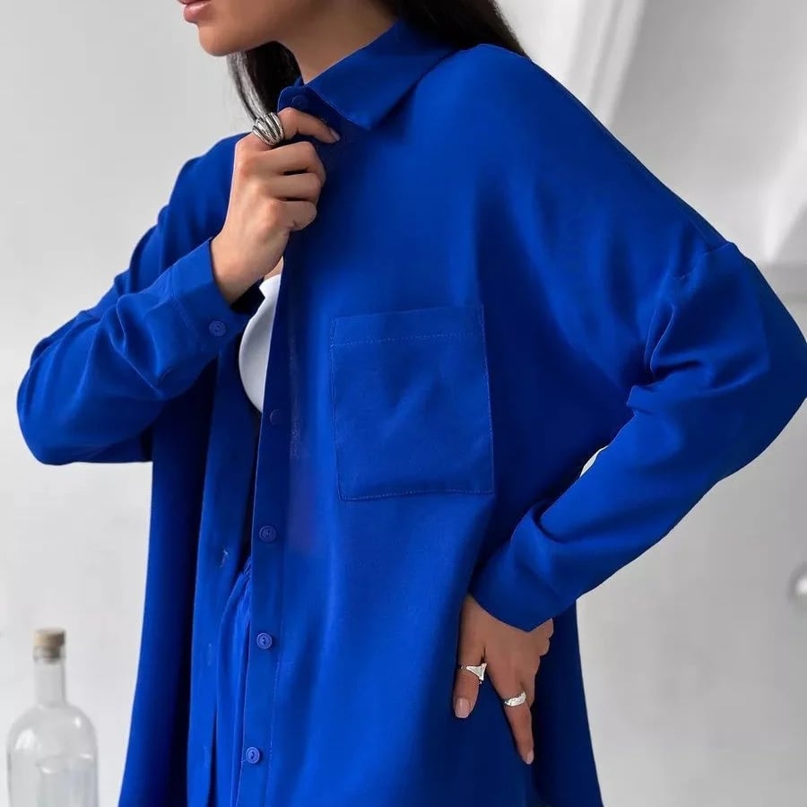 Elegant feminine set consisting of shirt and trousers