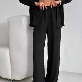 Elegant feminine set consisting of shirt and trousers