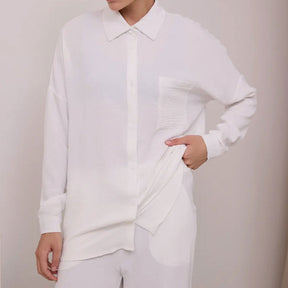 Elegant feminine set consisting of shirt and trousers