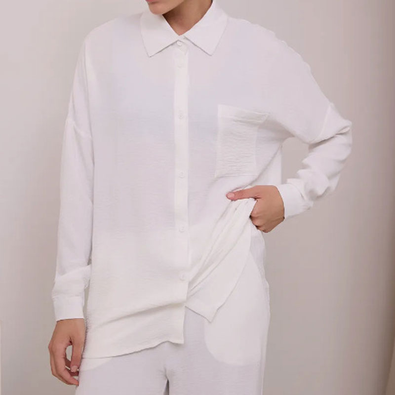 Elegant feminine set consisting of shirt and trousers
