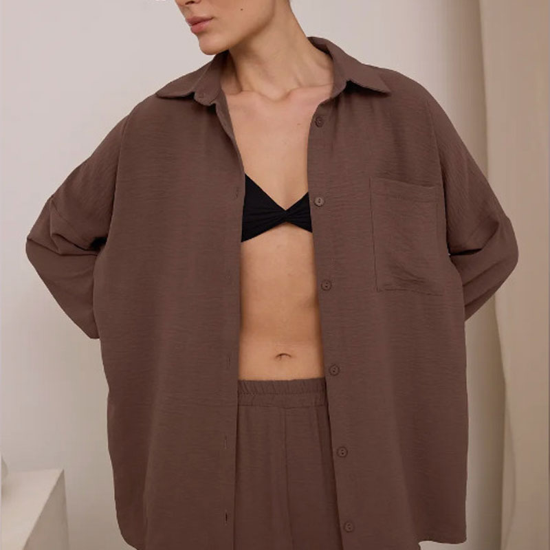 Elegant feminine set consisting of shirt and trousers