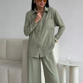 Elegant feminine set consisting of shirt and trousers